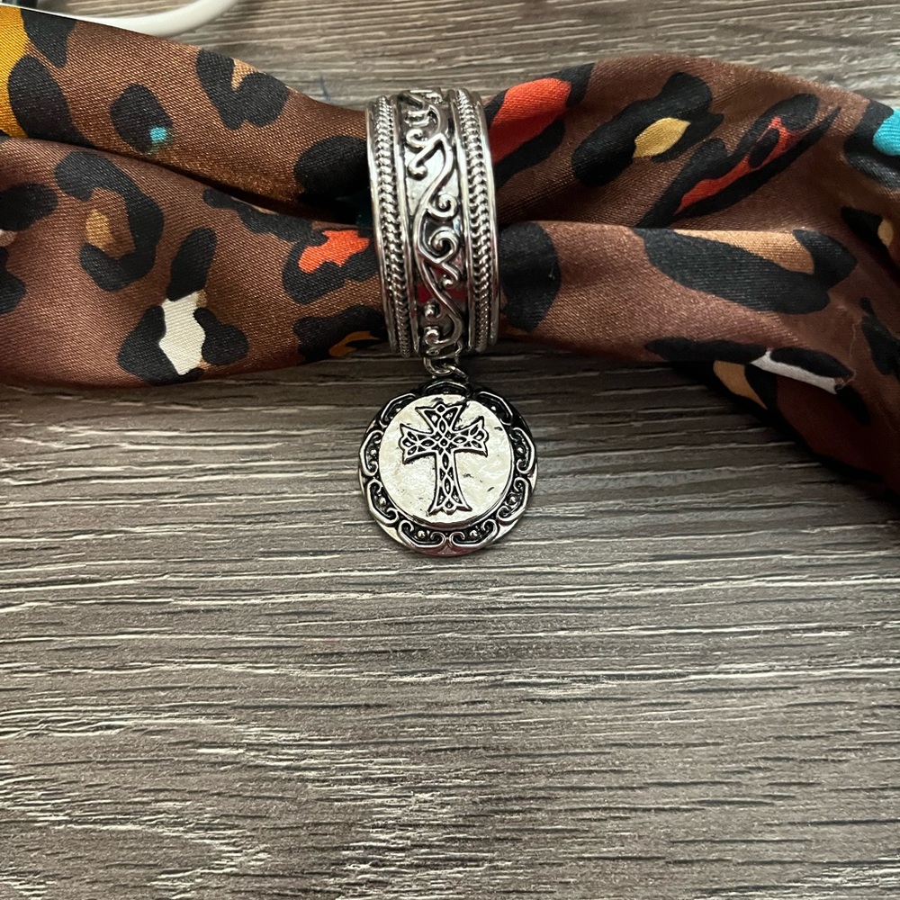 Silver cross scarf holder. Very pretty.